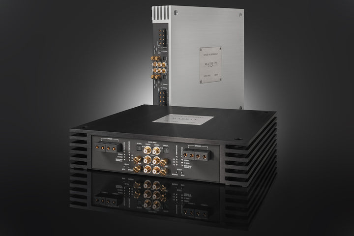 Brax MX4 amplifiers. One in black and one in silver.