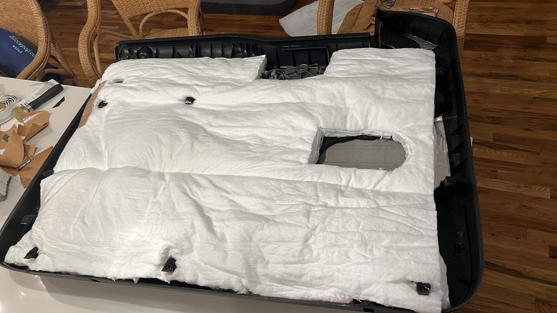 ResoNix Fiber Mat automotive sound absorber installed onto the back of a car door panel