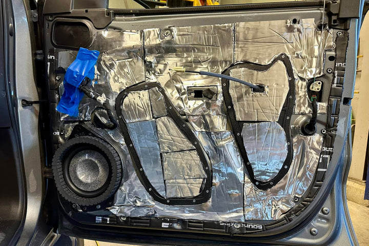 ResoNix CLD Squares sound deadening mats applied to the inner door skin of a car door