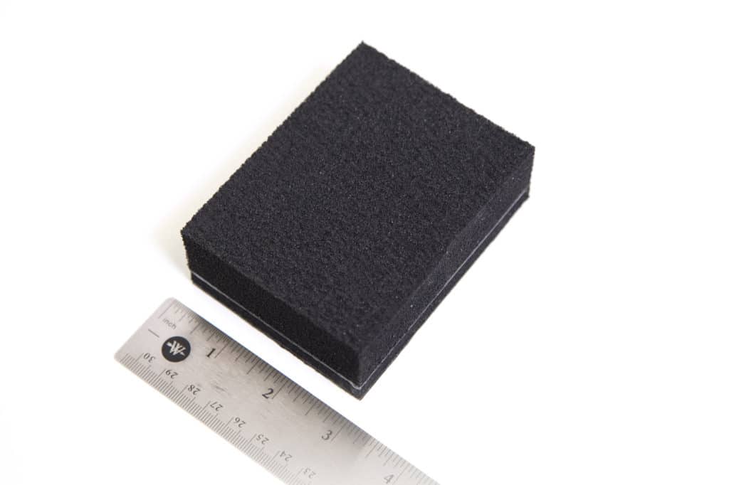 Blackhole Tiles automotive sound absorber next to ruler