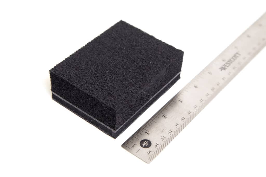 Blackhole Tiles automotive sound absorber next to ruler