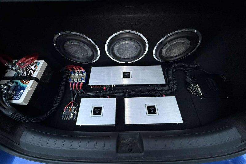 Caleb's Honda trunk with Focal Utopia subwoofers, Helix DSP Pro Mk3, and ResoNix Planet Waves Solderless RCA Cables