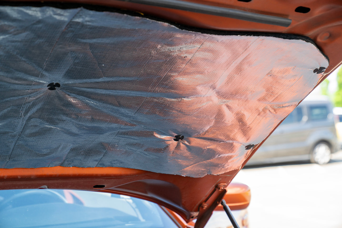 car hood lined with ResoNix Fiber Mat Silver sound and heat insulation material