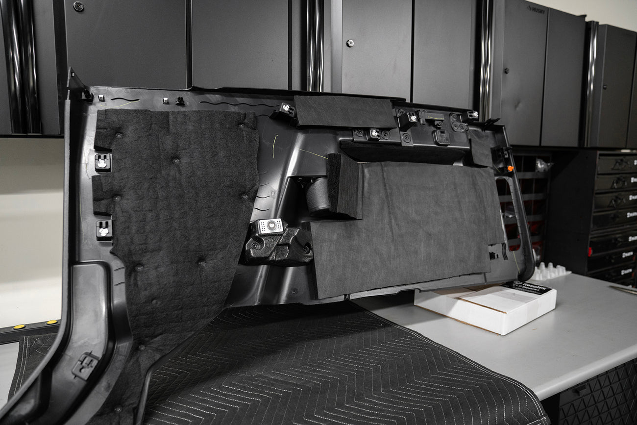ResoNix Fiber Mat automotive sound absorption material applied to the back of a vehicles plastic trim panel