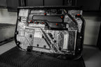 back side of a door panel that is treated with ResoNix CLD Squares automobile sound mats