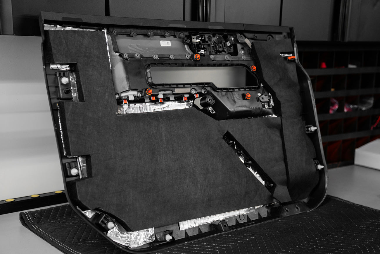 ResoNix Fiber Mat automotive sound absorber and thermal insulator installed onto the back of a door panel of a vehicle