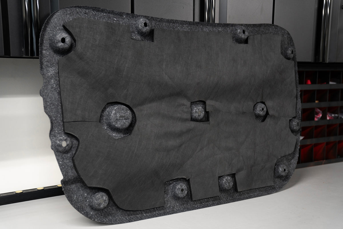 ResoNix Fiber Mat automotive sound absorption material installed onto the back of a hood liner for automotive heat insulation