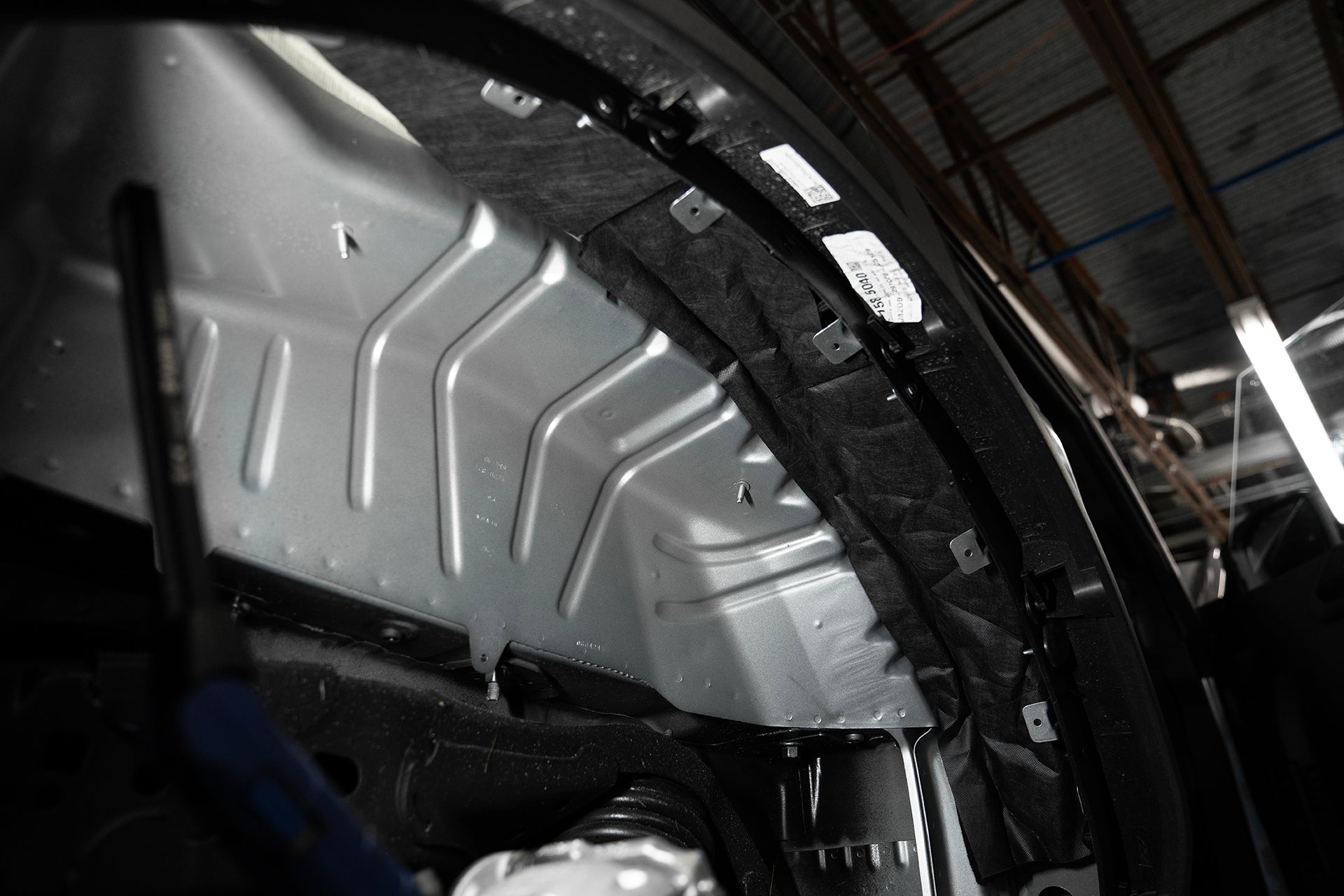 ResoNix Fiber Mat automotive sound absorption material installed into the wheel well of a vehicle