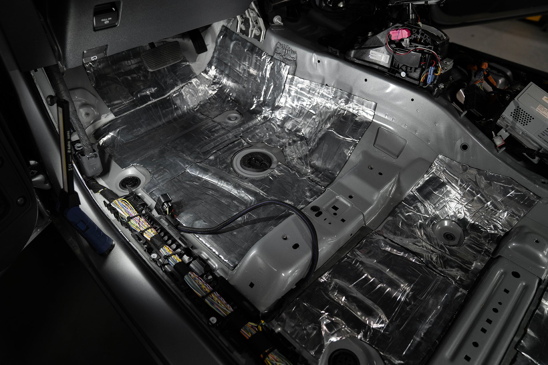 ResoNix Sound Solutions CLD Squares Sound Deadener installed into the front drivers side floor of a Ford Bronco