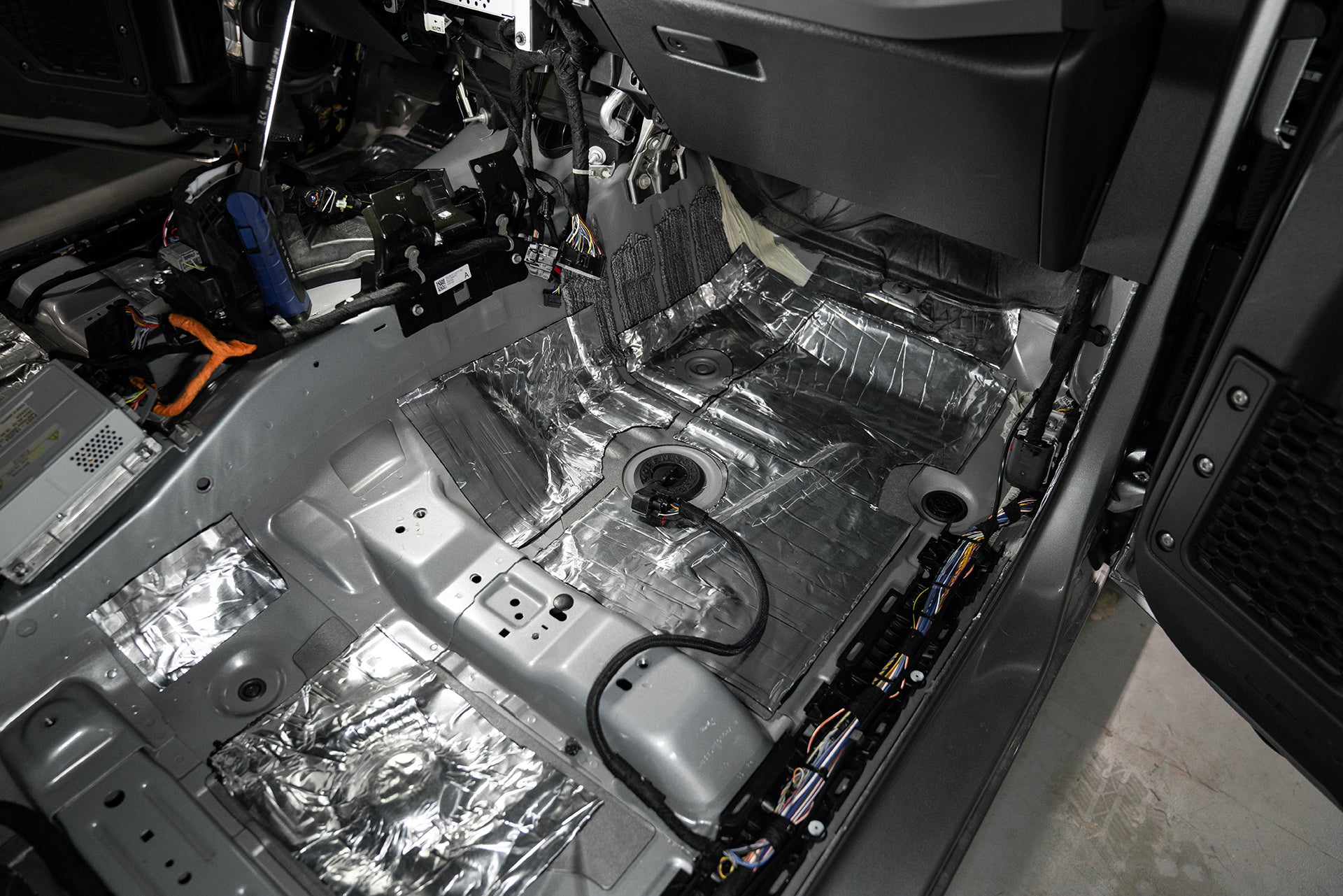 ResoNix Sound Solutions CLD Squares Sound Deadener installed into the front passenger side floor of a Ford Bronco
