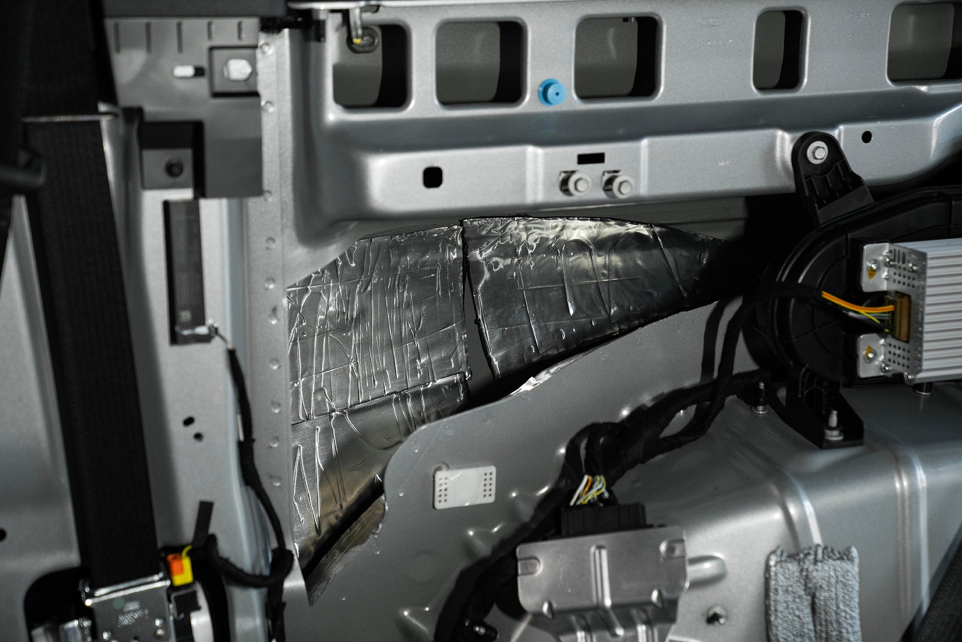 ResoNix Sound Solutions CLD Squares Sound Deadener installed into the passenger side quarter panel of a Ford Bronco