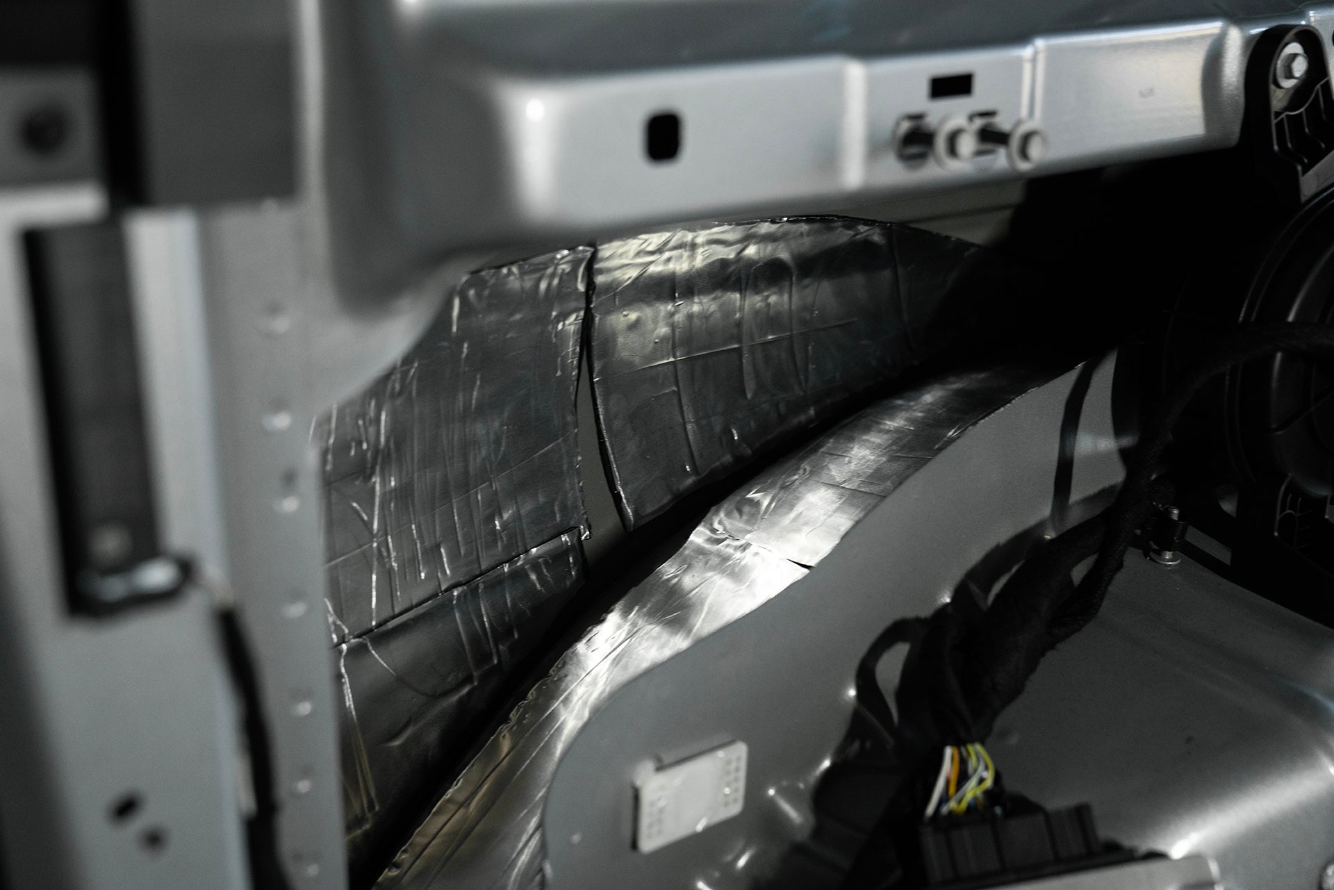 ResoNix Sound Solutions CLD Squares Sound Deadener installed into the passenger side quarter panel of a Ford Bronco close up