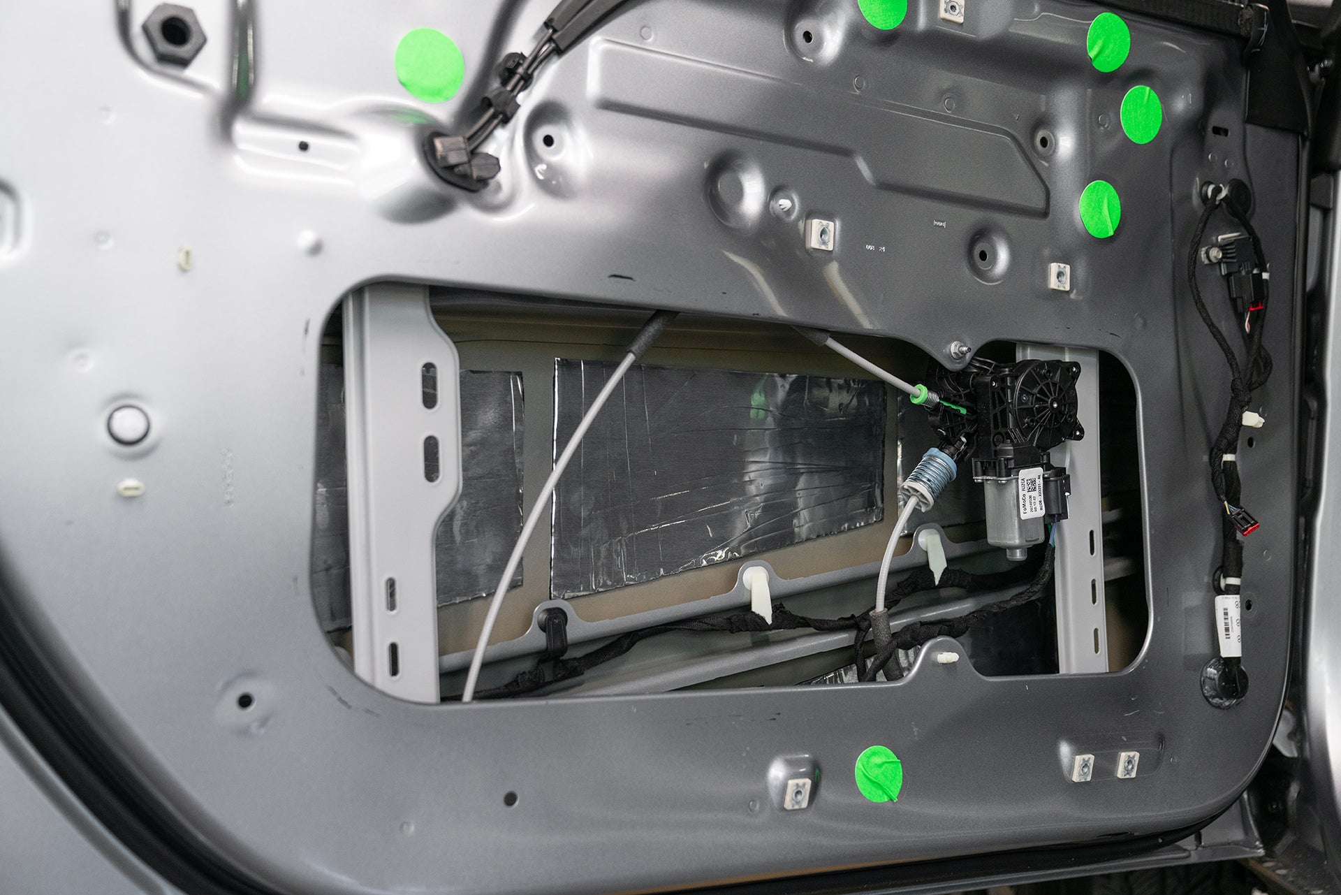 Ford Bronco Inner and outer door skin door panel removed. ResoNix CLD Squares installed onto outer door skin close up