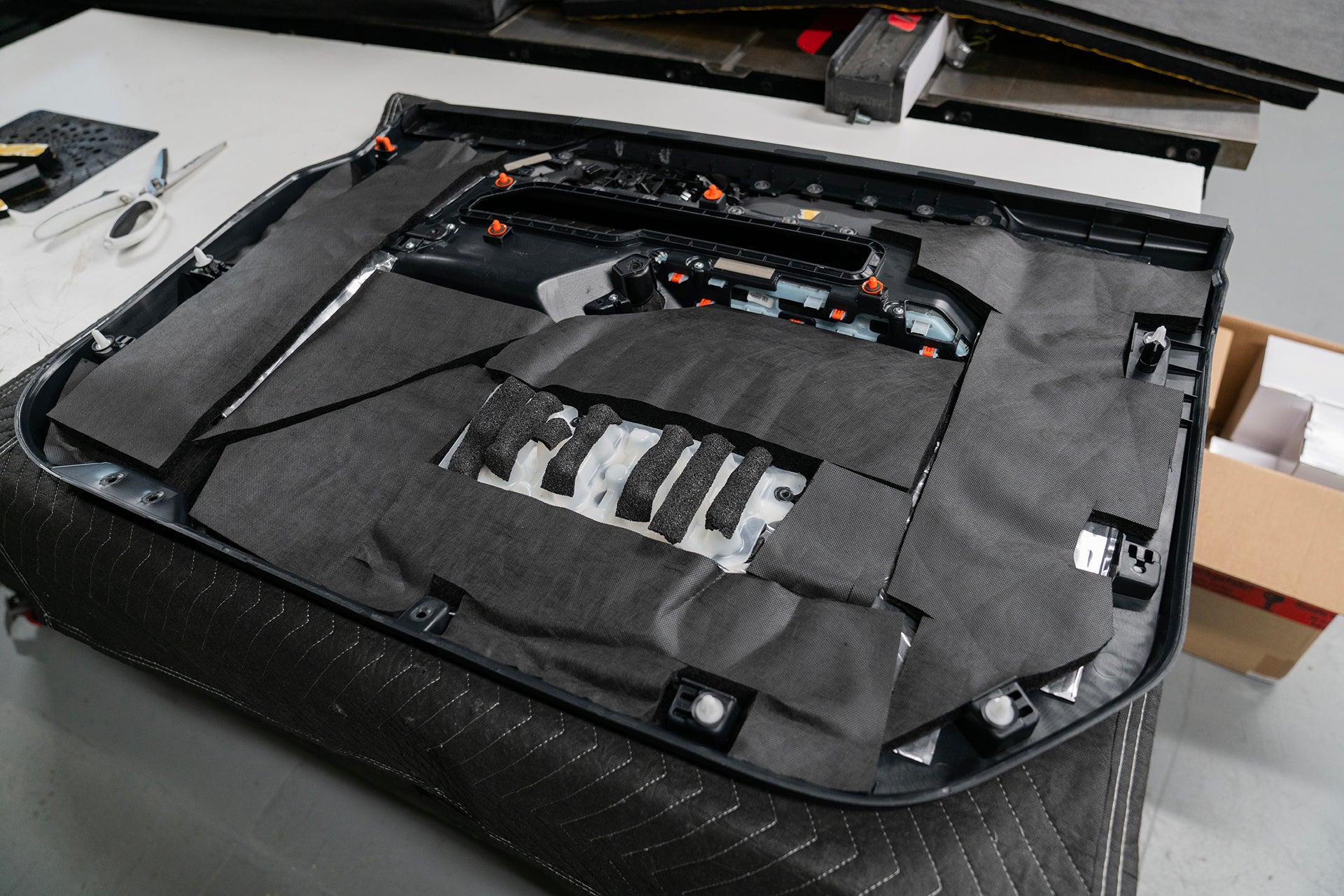 Ford Bronco with ResoNix Sound Solutions Fiber Mat installed onto the back of the door panel