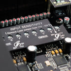 Close up of the Helix DSP Ultra S 12-channel car audio DSP analog input sensitivity adjustment knobs
