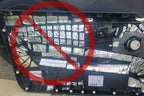 picture of a car door panel with a crossed out sign showing how to NOT sound deaden a car door panel