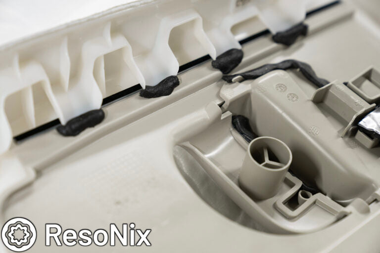 ResoNix Butyl Rope on clips of small automotive B-pIllar trim panel to prevent rattles