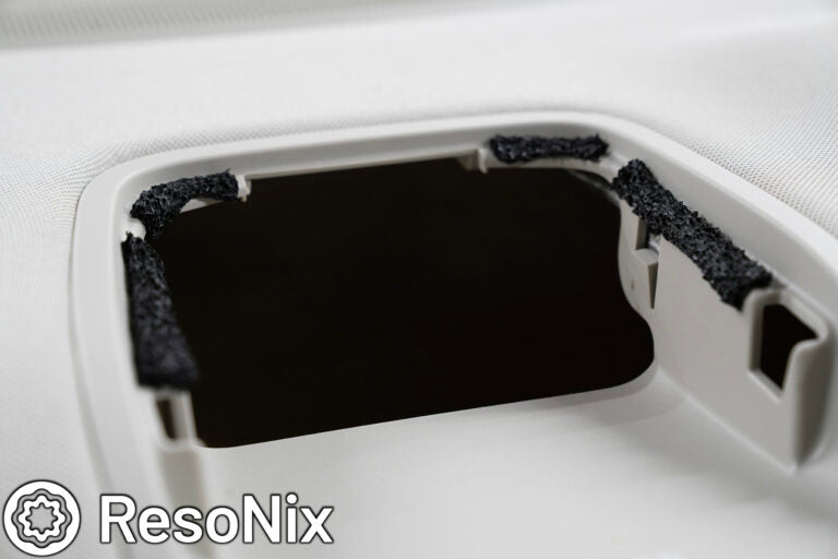 ResoNix CCF Decoupler Tape on clips of small automotive trim panel to prevent rattles