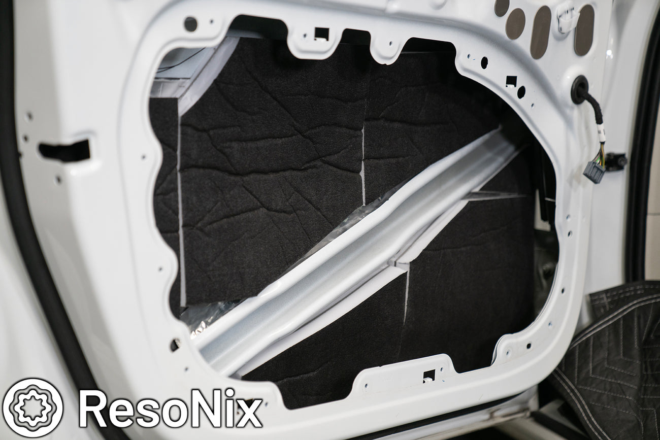 Car door with ResoNix Guardian soundproofing and CLD Squares sound deadening mats installed