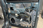 ResoNix CLD Squares sound deadening mats applied to the inner door skin of a car door