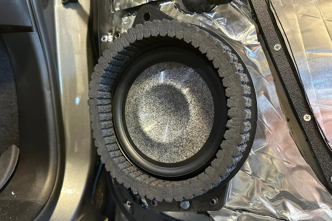 ResoNix Sound Solutions CCF Strip installed around focal utopia 8wm midbass speaker on a GMC Sierra inner door skin