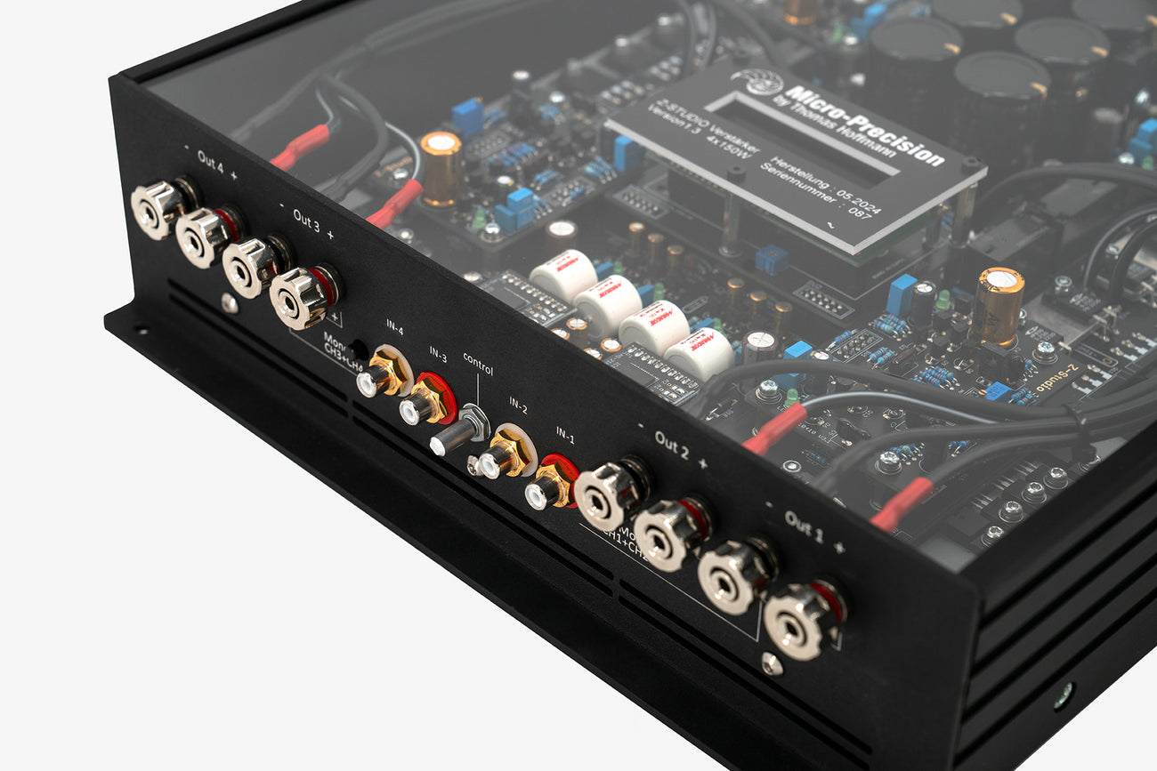 A close up shot of a the inputs and outputs of a Micro Precision Z-Studio 4c 4-channel car audio amplifier 