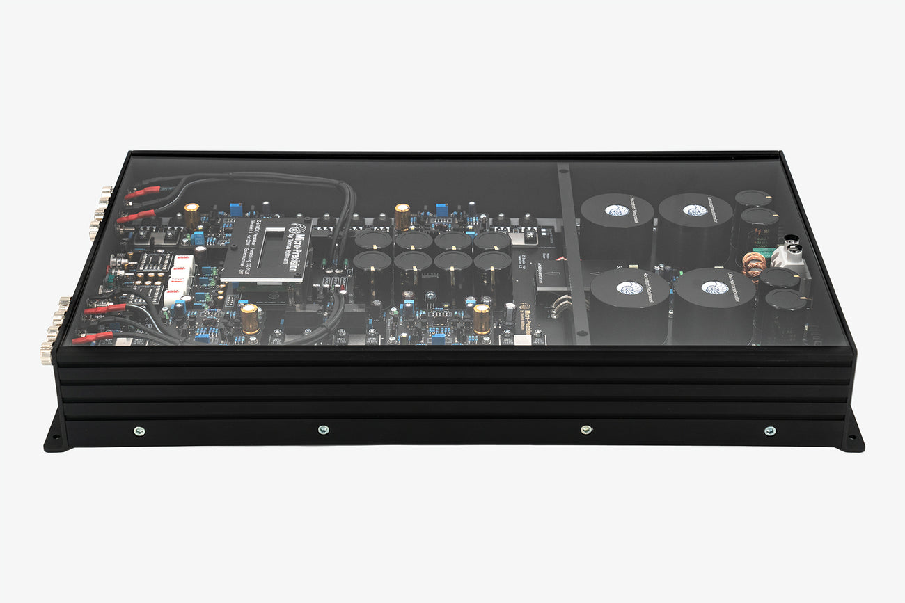 A Micro Precision Z-Studio 4c 4-channel car audio amplifier with visible electronic components, circuitry, and connectors on the top surface.
