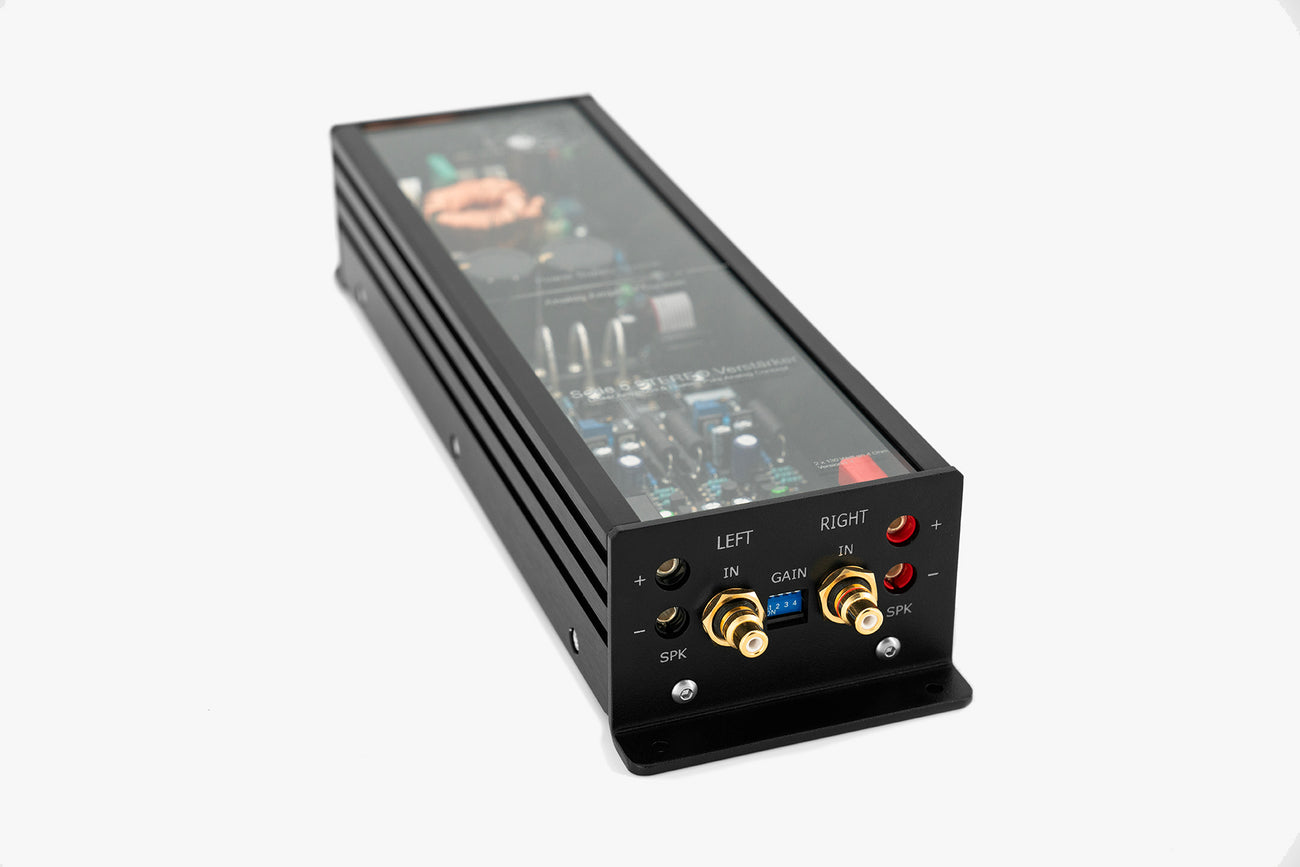 Micro Precision 5-Series two channel high end car audio amplifier with a close up focus on the input and outputs side panel