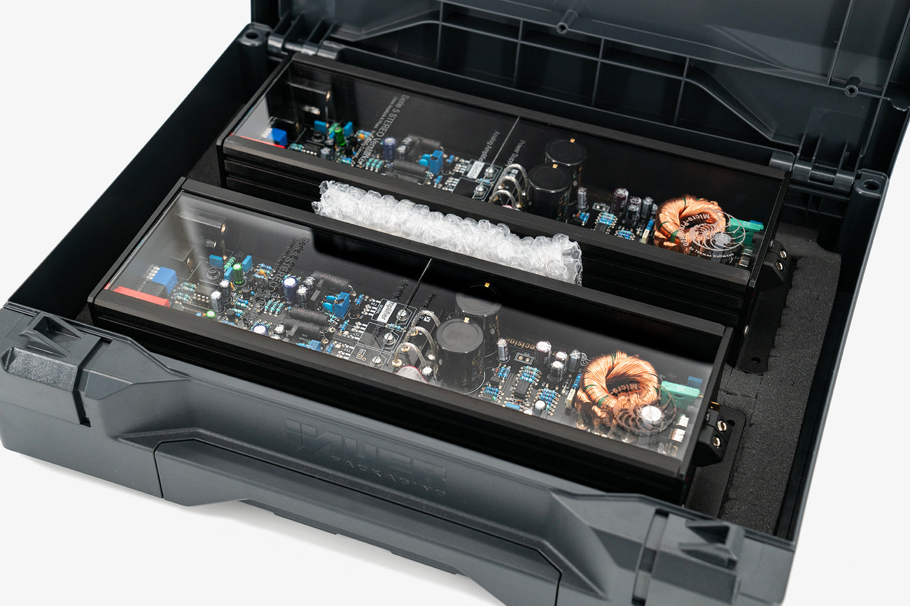 a pair of Micro Precision 5-Series two channel high end car audio amplifiers in their shipping case