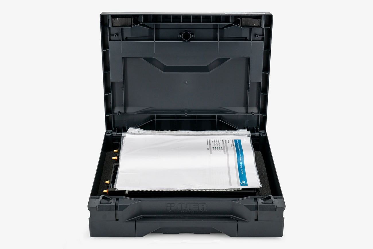 a pair of Micro Precision 5-Series two channel high end car audio amplifiers in their shipping case with the spec sheet