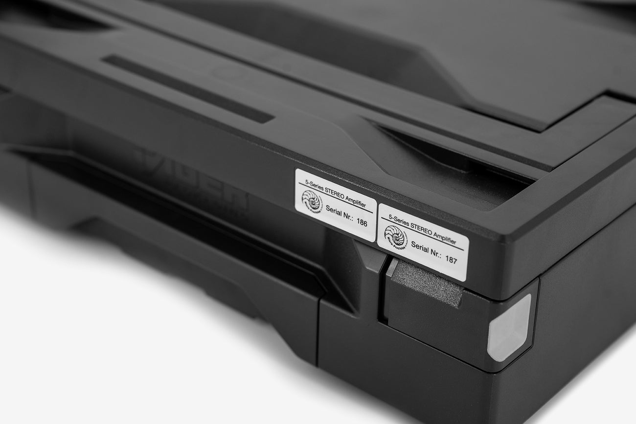 Close up of the corner of the Micro Precision shipping case showing the SKU and Serial Number sticks of the 5-Series 2-channel stereo car audio amplifiers