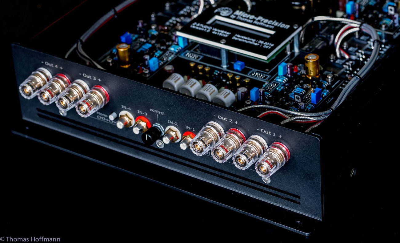 A close up shot of a the inputs and outputs of a Micro Precision Z-Studio 4c 4-channel car audio amplifier 