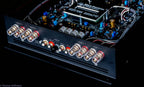 A close up shot of a the inputs and outputs of a Micro Precision Z-Studio 4c 4-channel car audio amplifier 
