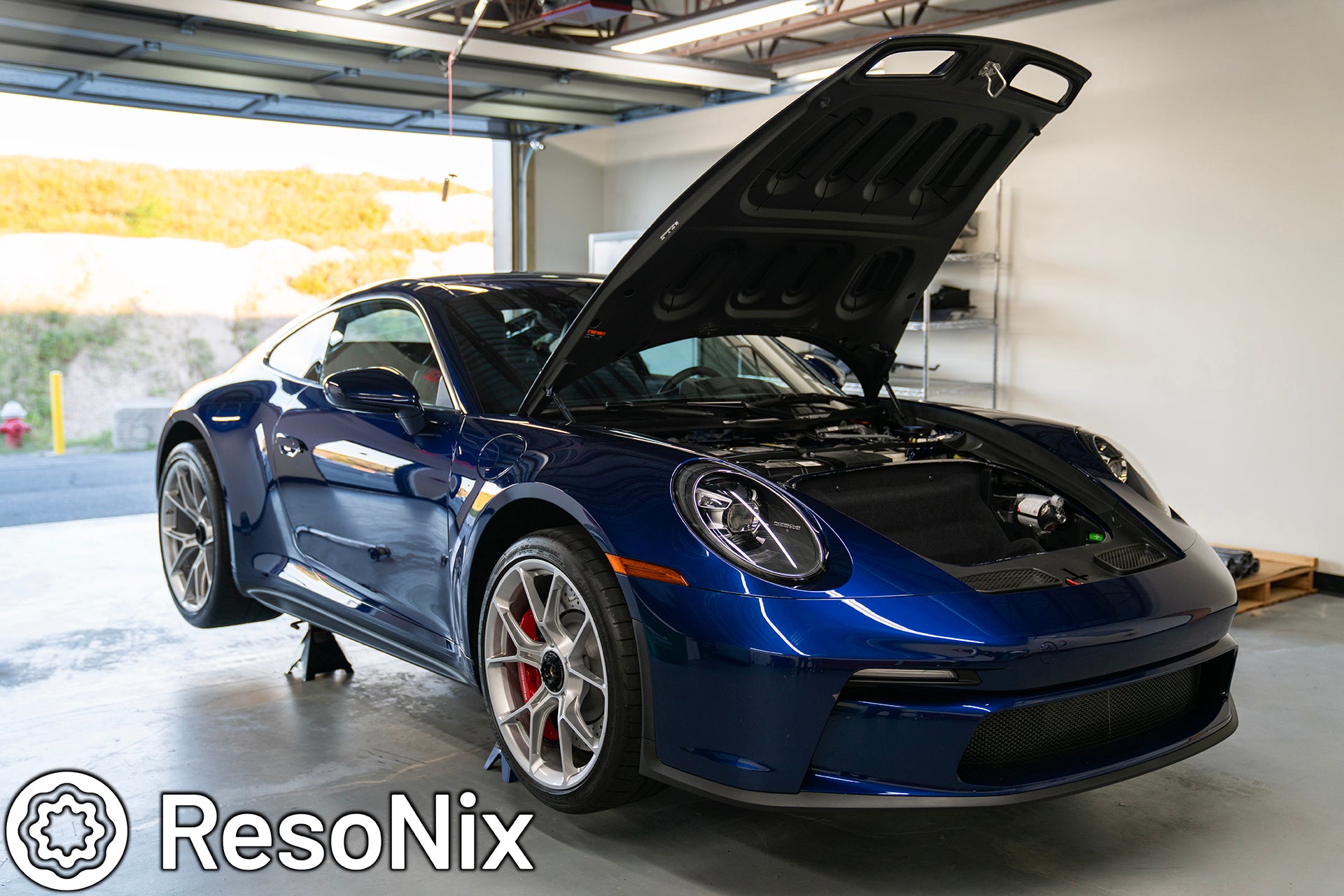 Porsche 922 911 GT3 Touring Lifted on jack stands getting ready for ResoNix Sound Solutions Sound Deadening Material installation to reduce wind, road, tire, and exhaust noise