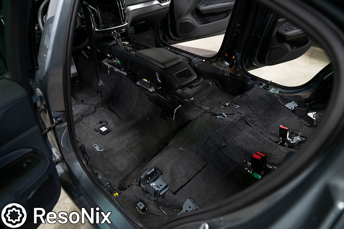 ResoNix Barrier installed and completely covering the floor of a vehicle with a stripped interior