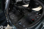 ResoNix Barrier installed and completely covering the floor of a vehicle with a stripped interior
