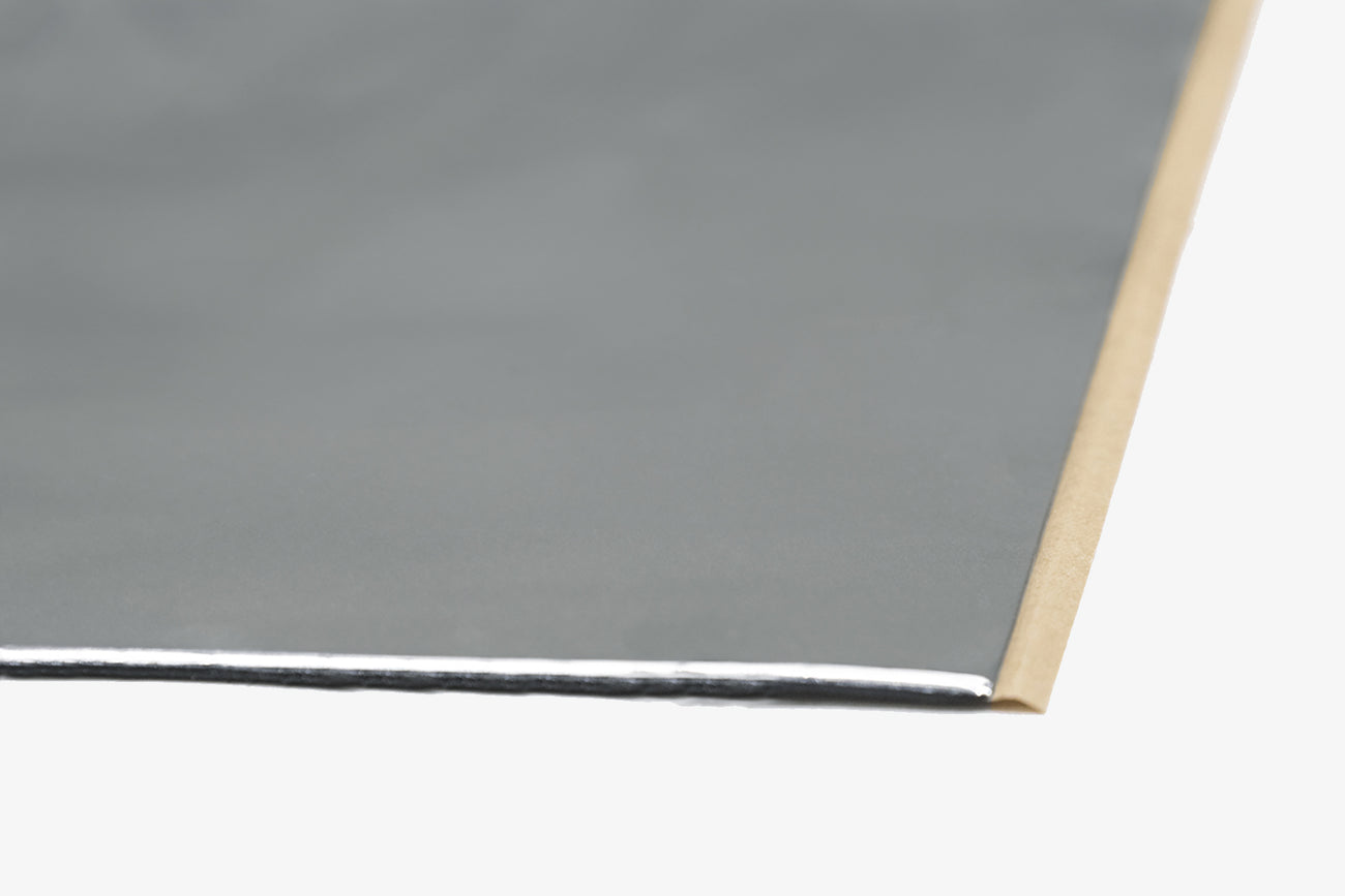 close up of the corner of ResoNix Lite CLD Rectangles sound deadener mats for cars