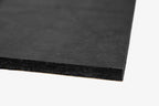 Close up of the corner of ResoNix Fiber Mat Black Edition automotive sound absorber material