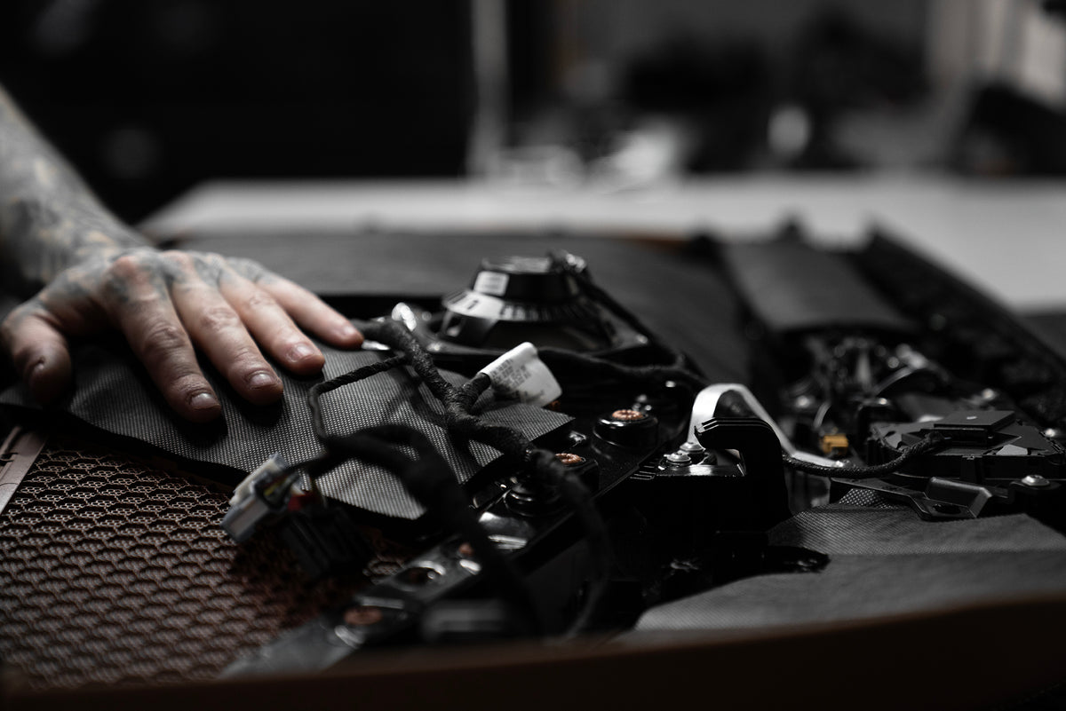 Close up of a Porsche 911 door panel that has ResoNix Fiber Mat applied to it