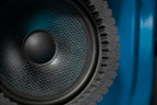 close up of a speaker installed into a car door with ResoNix CCF Strips fast rings installed around it