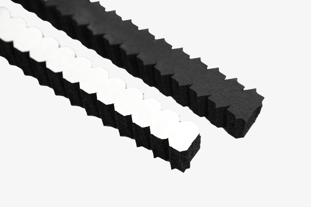 ResoNix Sound Solutions Fast Rings to couple speakers to panels and grille openings - one flipped over to show adhesive backing paper top view