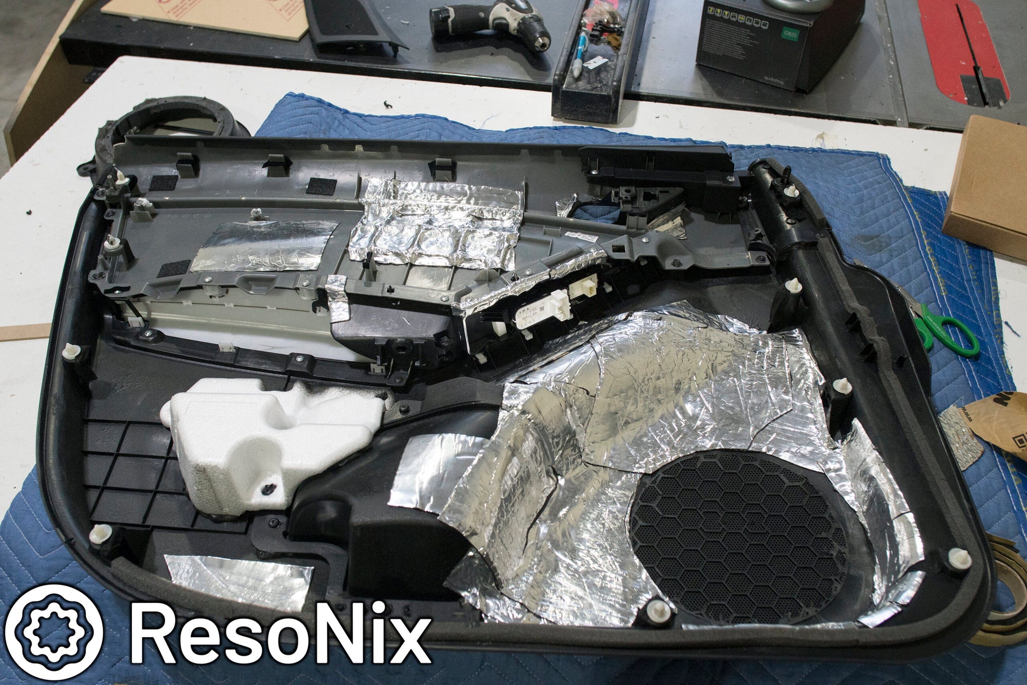 Back of Door panel - ResoNix Sound Solutions Butyl Rope gasketing and sealant tape on the back of a door panel to reduce rattles and buzzes