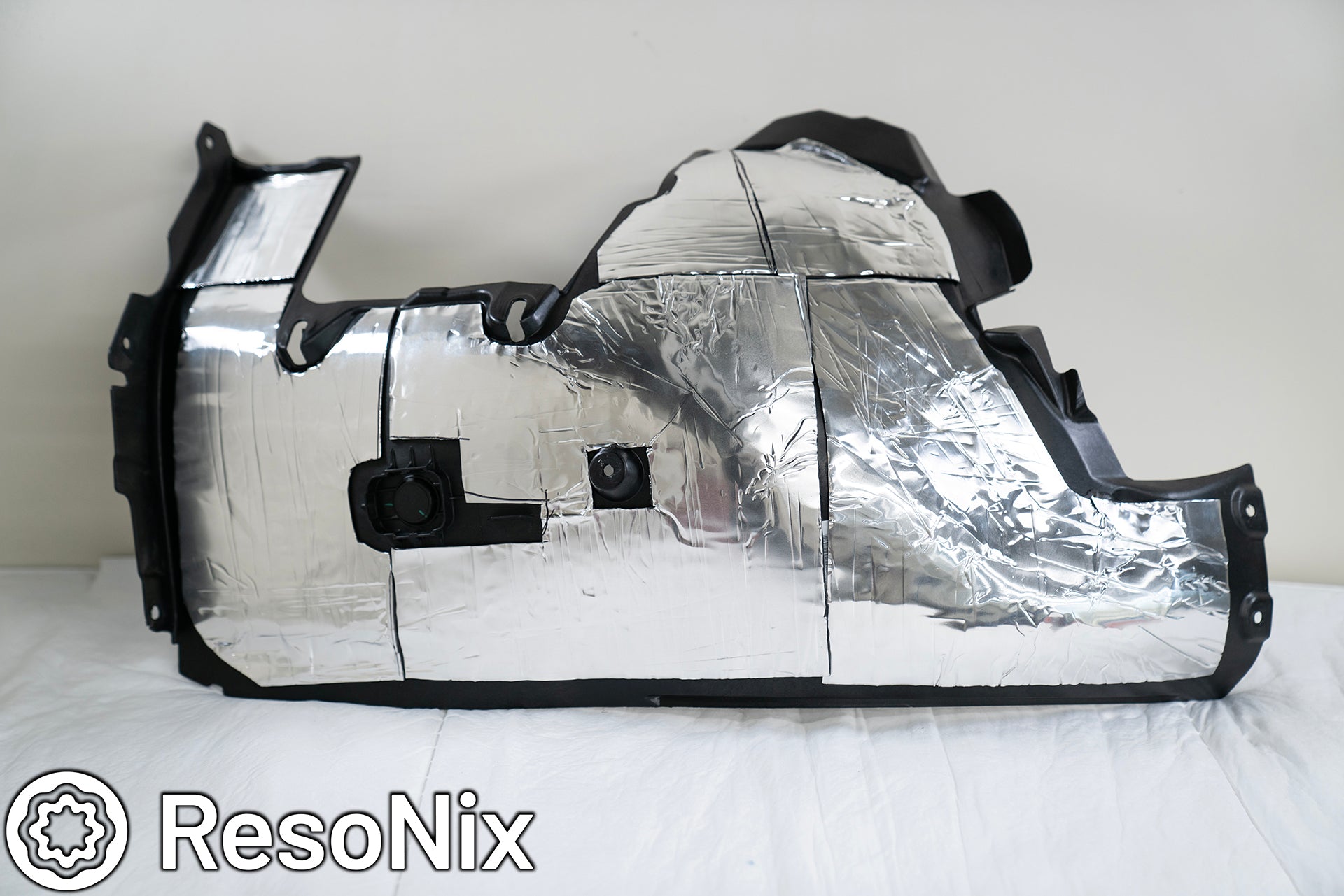 ResoNix Sound Solutions CLD Squares Sound Deadening Material installed onto the fender liners of a Porsche 911 to reduce wind, road, and tire noise