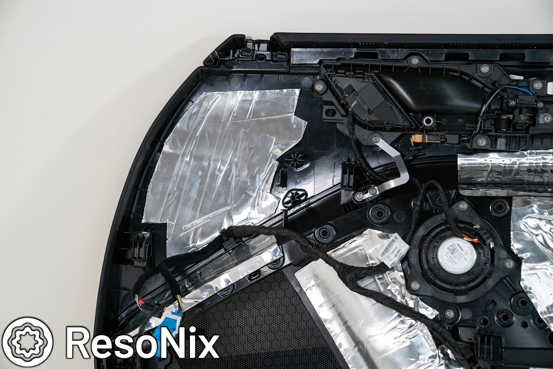 Porsche 911 Door Panel with ResoNix Sound Solutions Mega CLD Squares sound deadening material installed in order to reduce resonance, wind noise, and tire noise for a quieter ride and better sound system performance