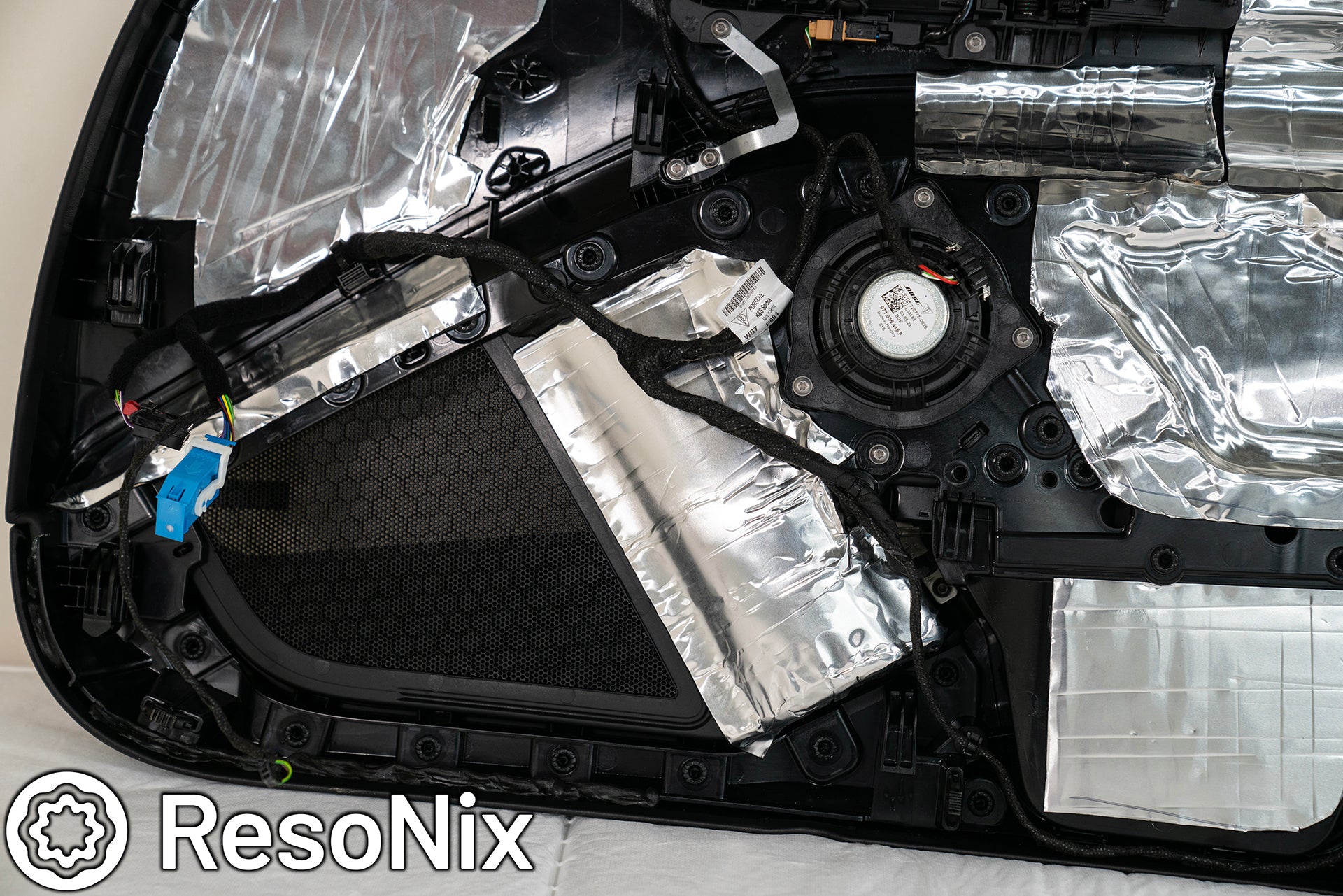 Porsche 911 Door Panel with ResoNix Sound Solutions Mega CLD Squares sound deadening material installed in order to reduce resonance, wind noise, and tire noise for a quieter ride and better sound system performance