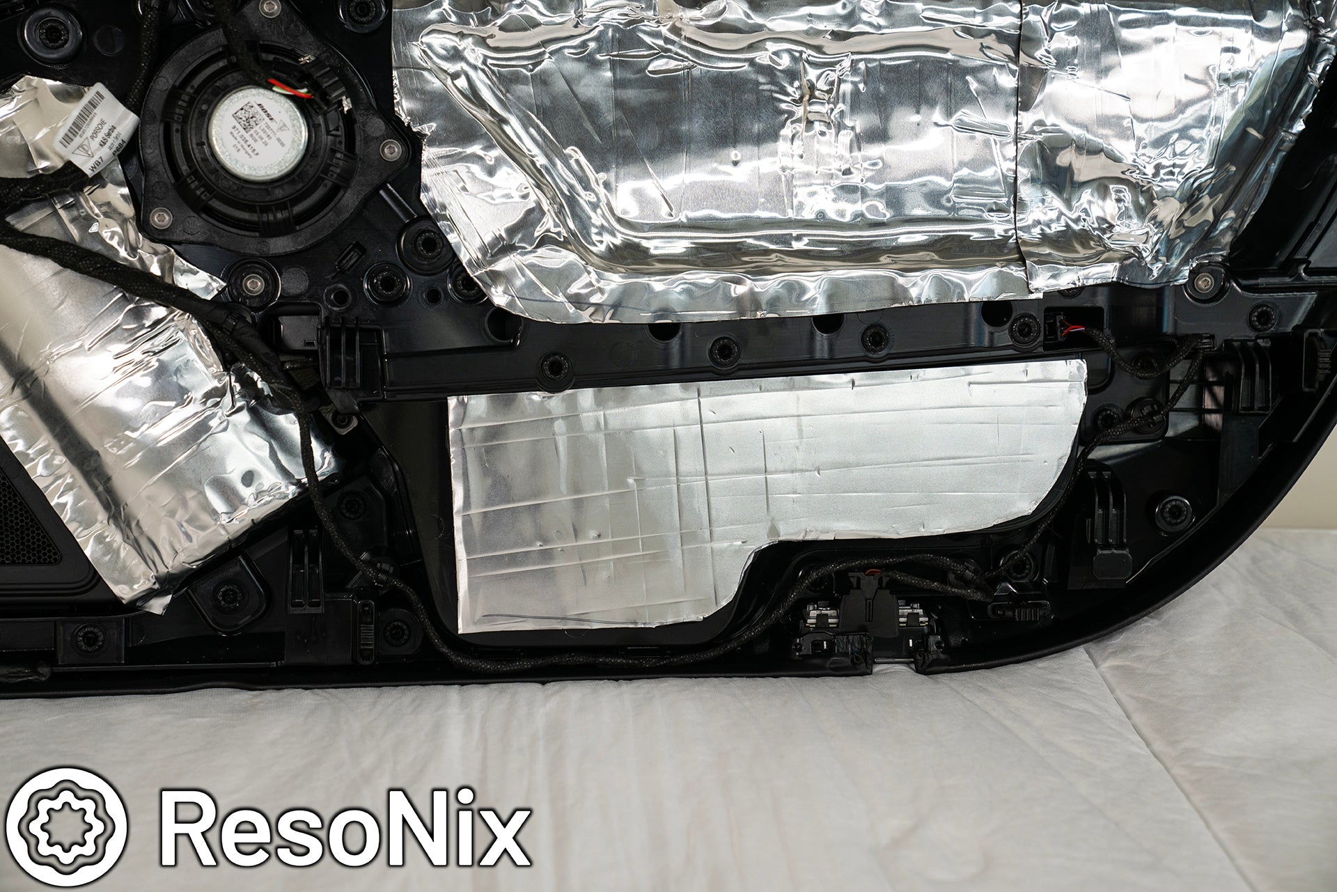 Porsche 911 Door Panel with ResoNix Sound Solutions Mega CLD Squares sound deadening material installed in order to reduce resonance, wind noise, and tire noise for a quieter ride and better sound system performance