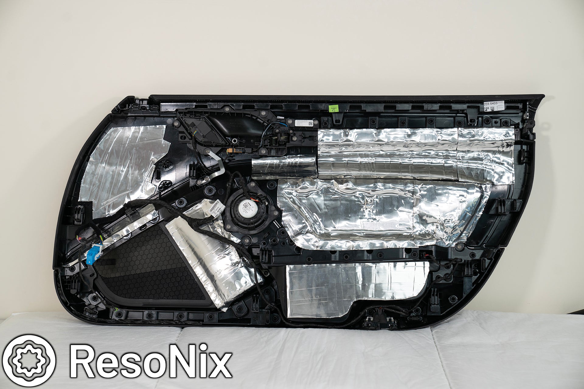 Porsche 911 Door Panel with ResoNix Sound Solutions Mega CLD Squares sound deadening material installed in order to reduce resonance, wind noise, and tire noise for a quieter ride and better sound system performance