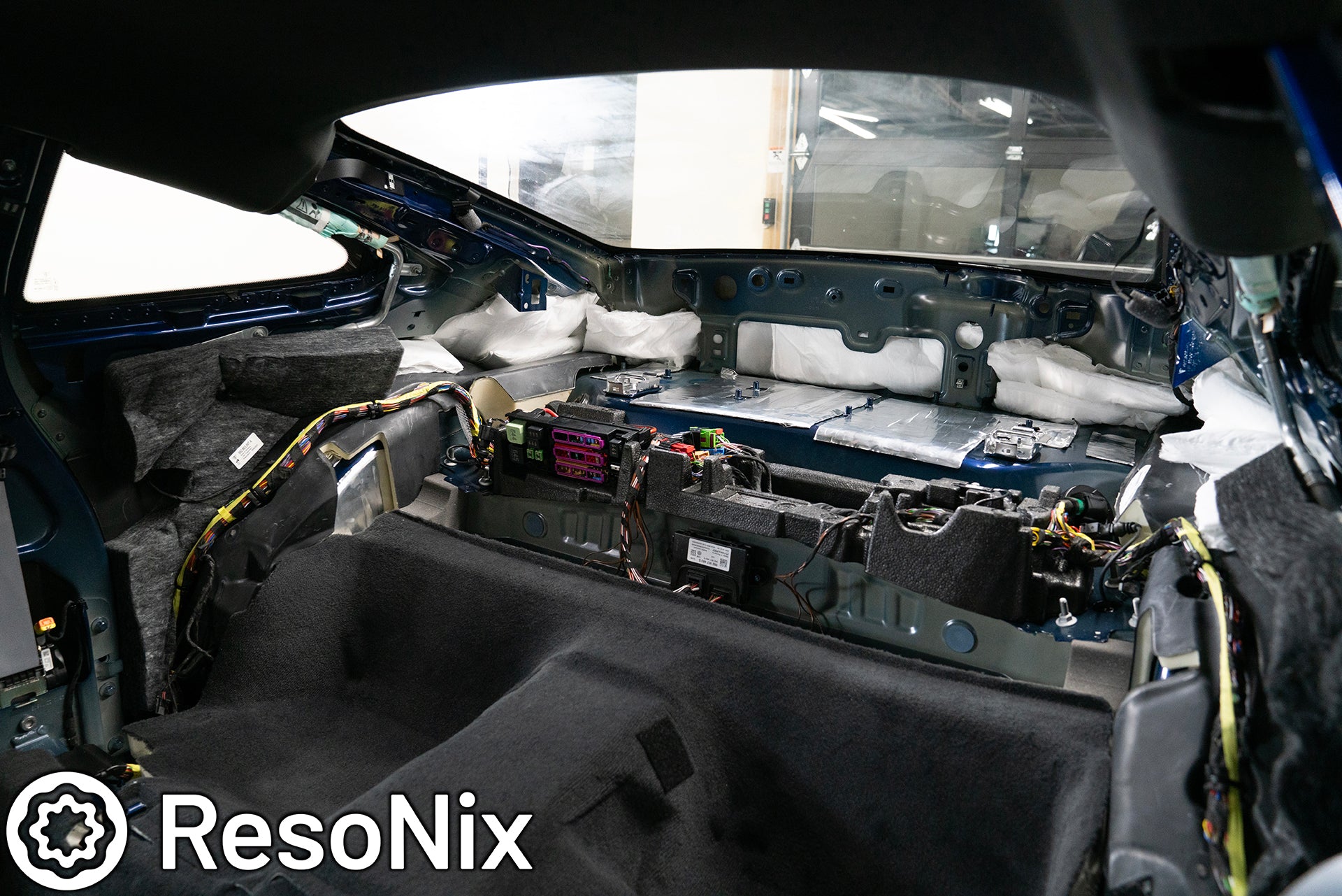 ResoNix Sound Solutions CLD Squares sound deadening material and Fiber Mat sound absorption material installed into the rear interior of a Porsche 992 911 GT3 Touring to reduce road, tire, wind, and exhaust noise