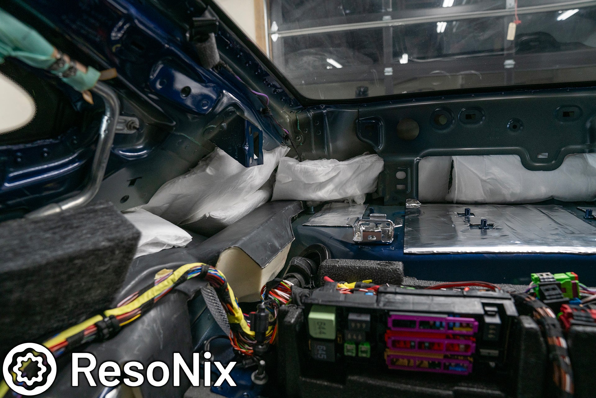 ResoNix Sound Solutions CLD Squares sound deadening material and Fiber Mat sound absorption material installed into the rear interior of a Porsche 992 911 GT3 Touring to reduce road, tire, wind, and exhaust noise