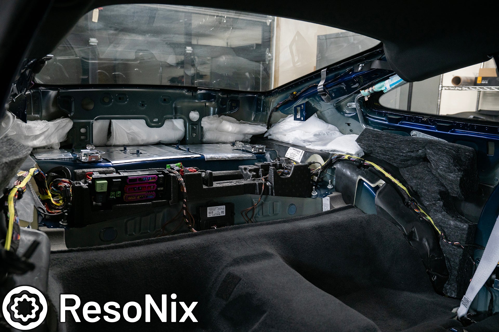 ResoNix Sound Solutions CLD Squares sound deadening material and Fiber Mat sound absorption material installed into the rear interior of a Porsche 992 911 GT3 Touring to reduce road, tire, wind, and exhaust noise